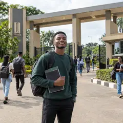 A university student at the campus gate