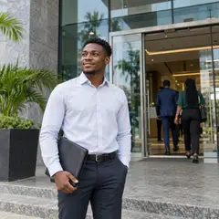 A man with a folder outside an office